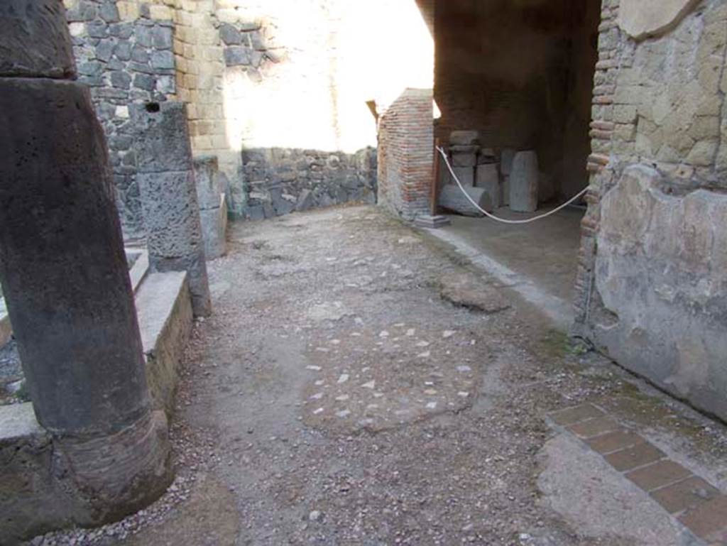 VII.2 Herculaneum. September 2015. Peristyle 10, looking north along east portico, with doorway to Exedra 11, on right. Photo courtesy of Michael Binns.